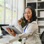 Confident professional woman in modern office setting.