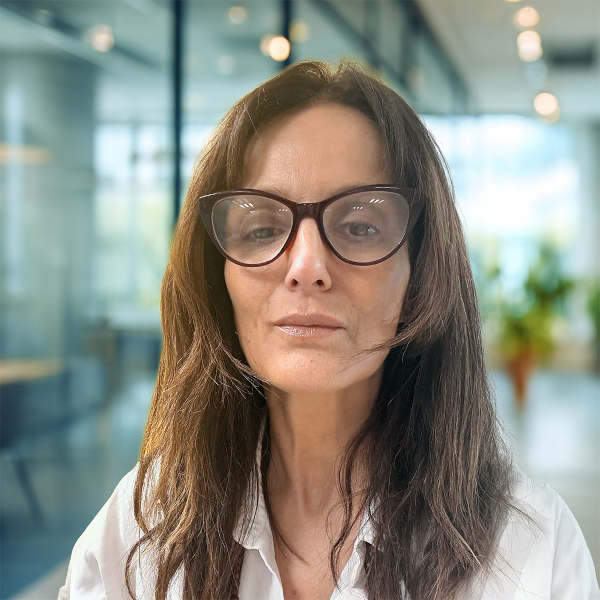 Woman wearing glasses in modern office setting