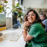 mid adult indian woman working on the computer in the office building in sydney in australia
