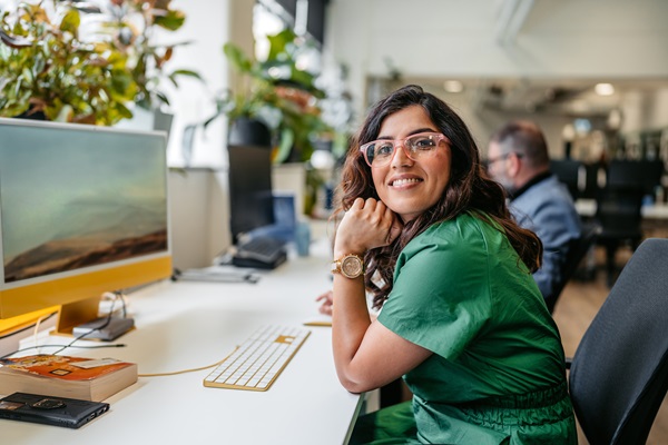mid adult indian woman working on the computer in the office building in sydney in australia