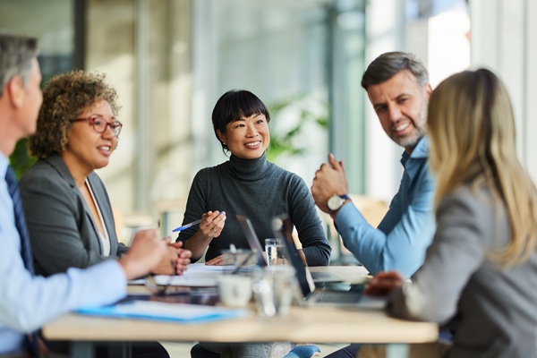 Business professionals collaborating in modern office meeting