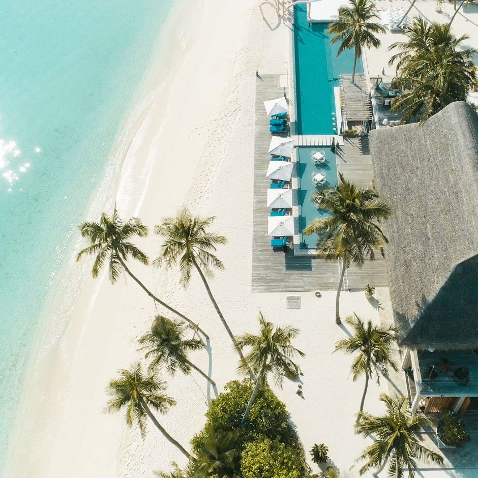 Aerial view of tropical beach resort with pool