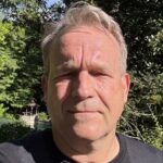 Person in garden on a sunny day.