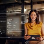 Businesswoman viewing digital flight information display.