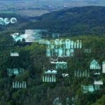 Futuristic data overlays on a forest landscape.