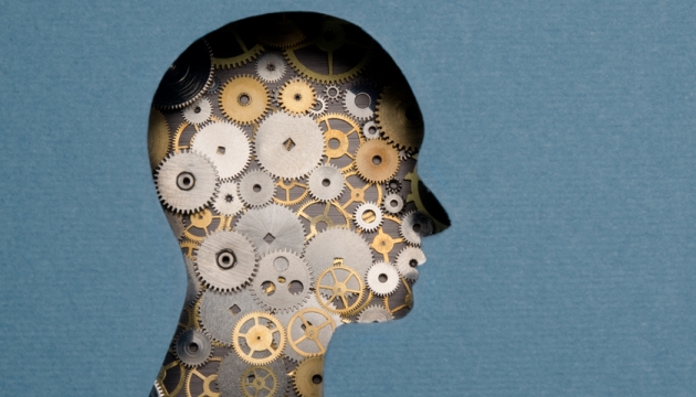 Silhouet met tandwielen als brein