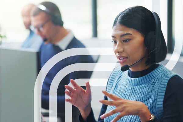 Customer service agent speaking with headset in office