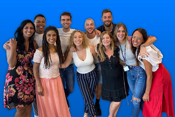 Smiling group of diverse people on blue background