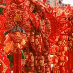 Red Chinese New Year decorations and ornaments displayed.