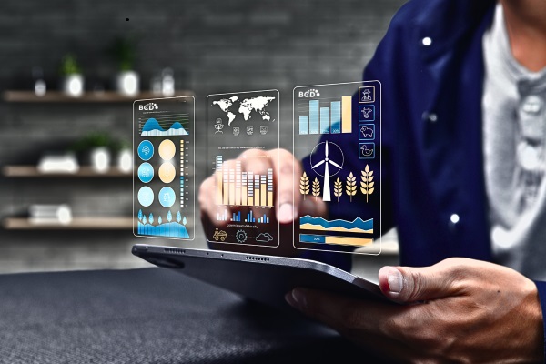 Person using digital tablet with data analytics graphs