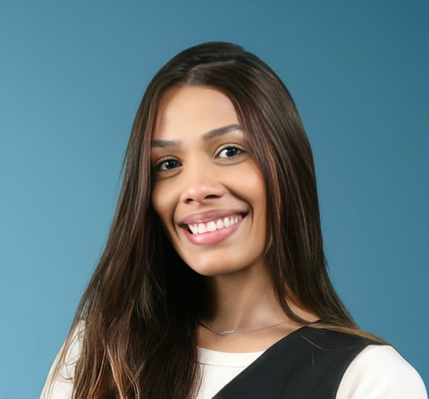 Smiling woman with long dark hair against blue background
