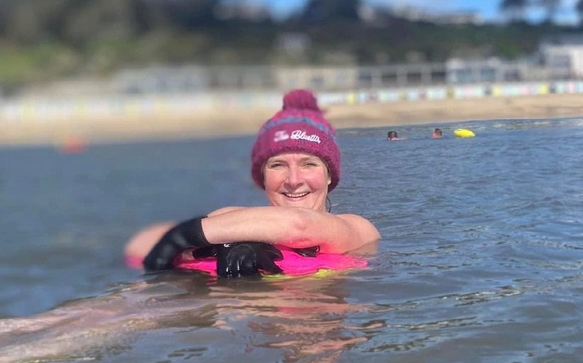 BCD Travel's Claire Stephens floats in the water during training for a 2-mile open water sea swim along the UK coastline – from Lyme Regis to Charmouth.