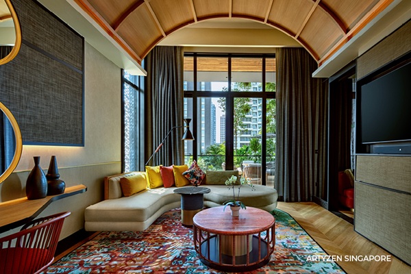 Luxurious hotel suite with modern decor and city view.