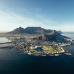 Aerial view of Cape Town, mountains, and coastline.