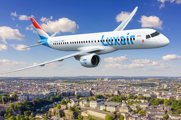 Luxair passenger jet flying over Luxembourg City