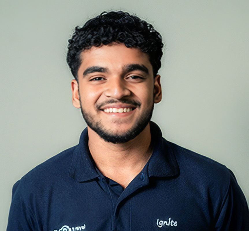 Smiling young man wearing a navy blue polo shirt