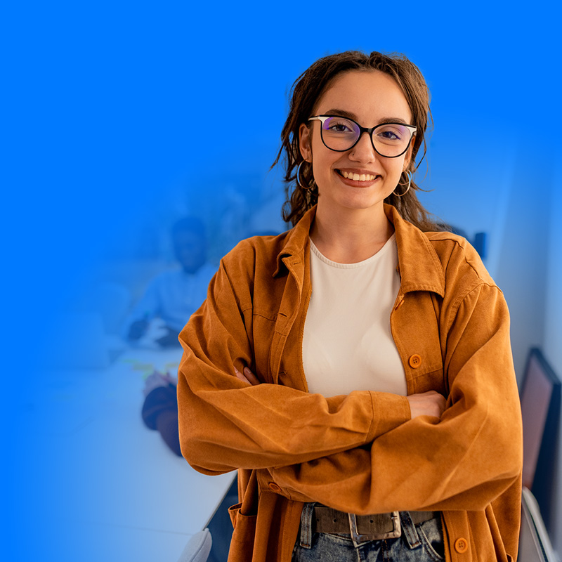 Confident woman in orange jacket smiling