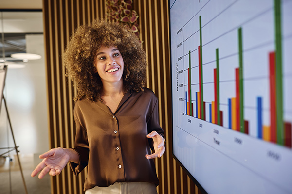 Woman presenting data with colorful bar chart