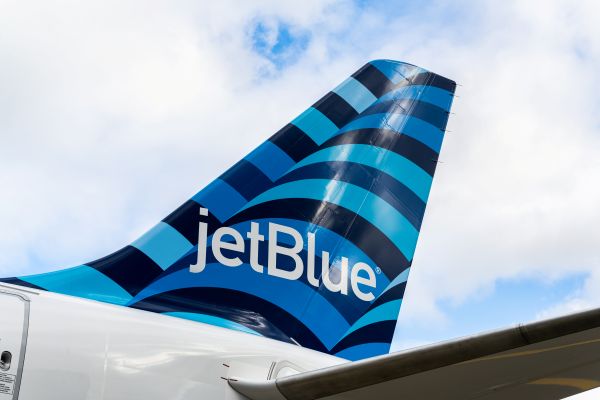 JetBlue airplane tail with blue mosaic pattern