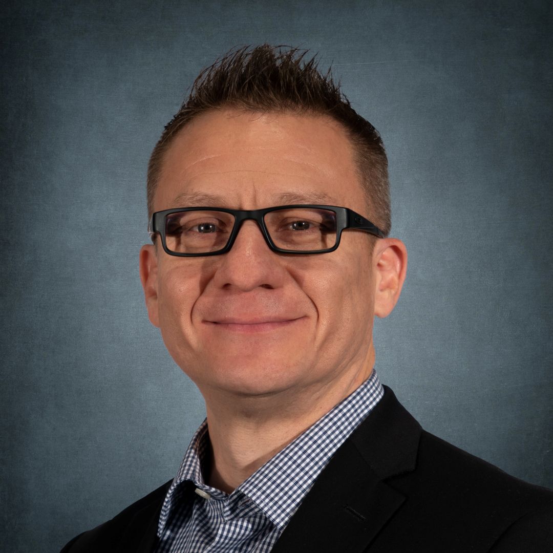 Man wearing glasses in professional headshot