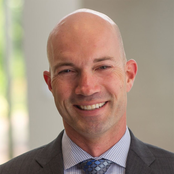 Smiling bald man in a suit