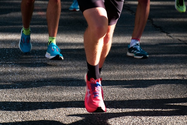 Runners in colorful shoes during a race
