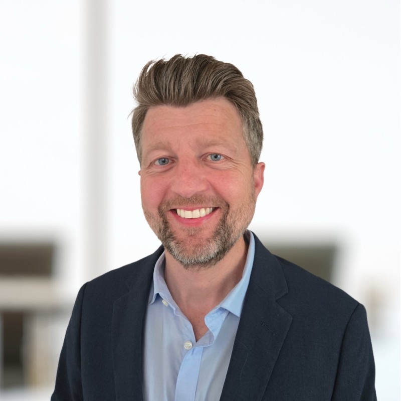 Smiling man in blazer indoors portrait