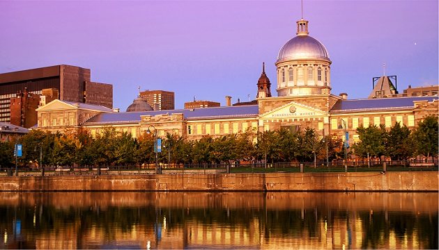 Historic Montreal building with dome at sunset