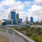 Scenic view of city skyline and riverfront.