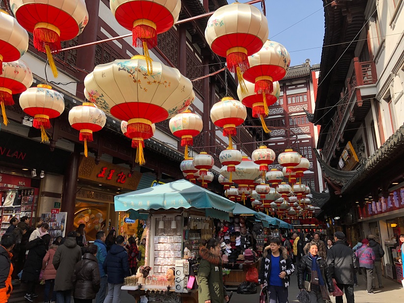Street market with hanging Chinese lanterns.