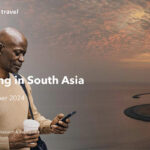 Man using phone, sunset in South Asia.
