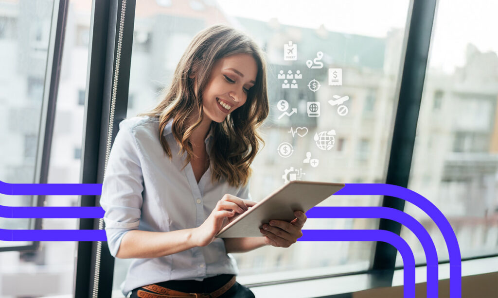 Woman using tablet with digital business icons