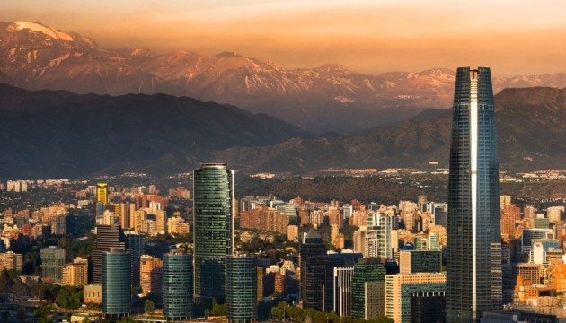 Santiago skyline with mountains at sunset.