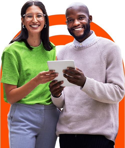 Two people smiling, holding a tablet