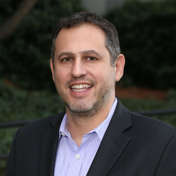 Smiling man in suit outdoors