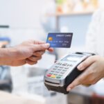 Contactless credit card payment at terminal.