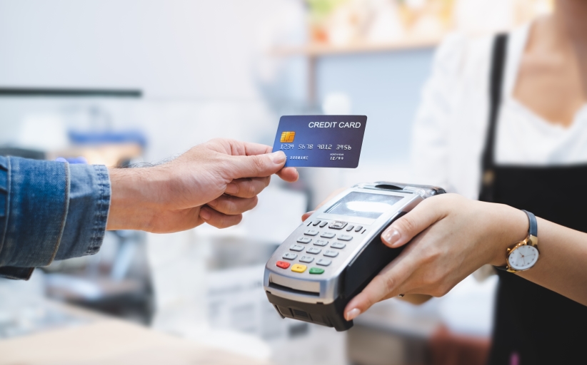 Contactless credit card payment at terminal.