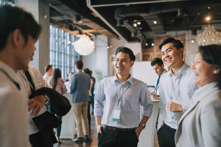 Smiling group at business networking event.