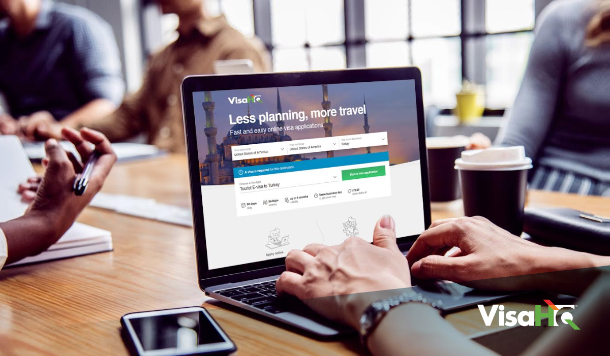 Person applying for visa on laptop at desk