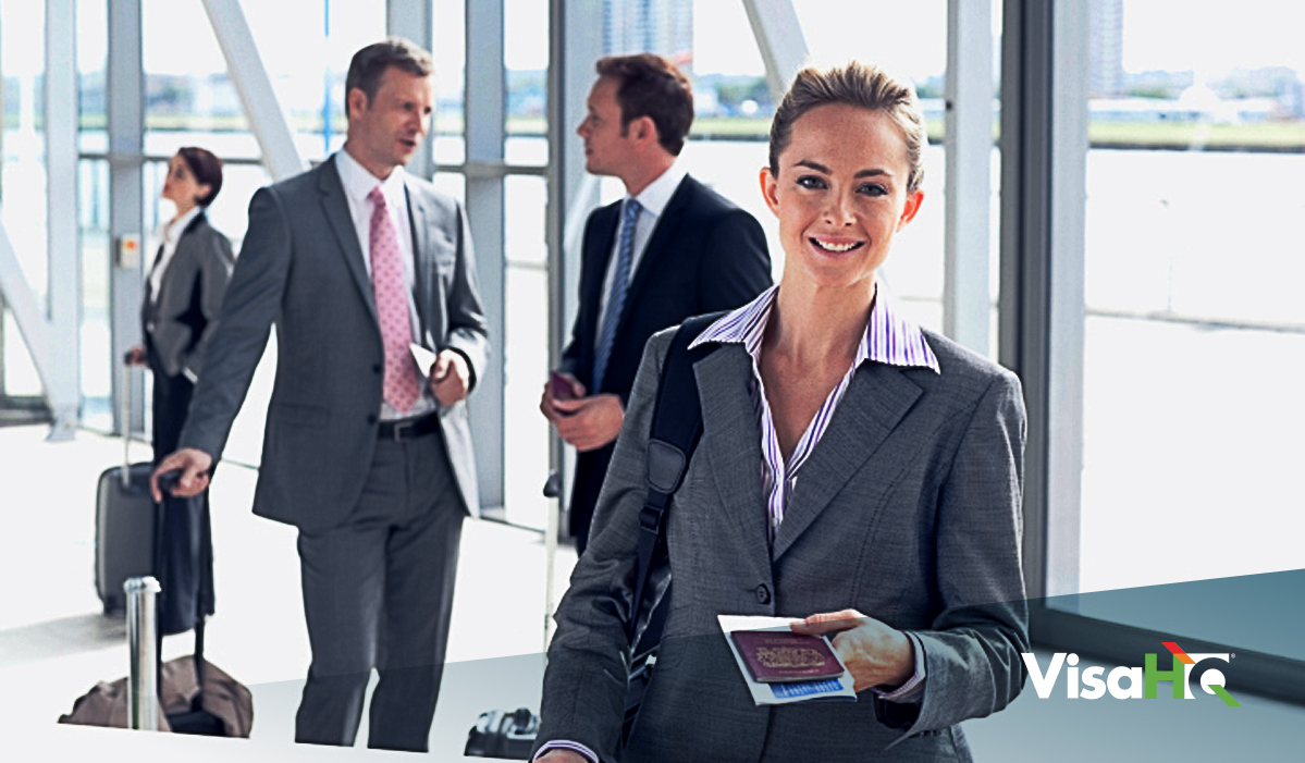 Businesswoman holding passport at airport terminal