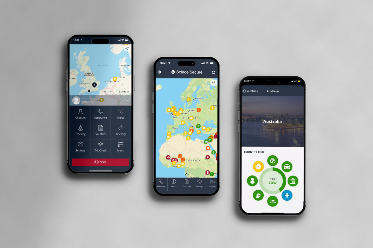 Three smartphones displaying travel security app maps