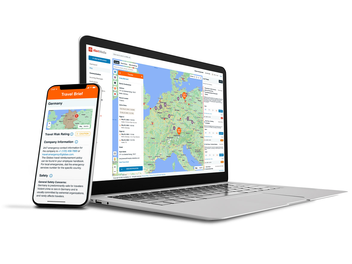 Laptop and smartphone displaying travel risk management dashboard